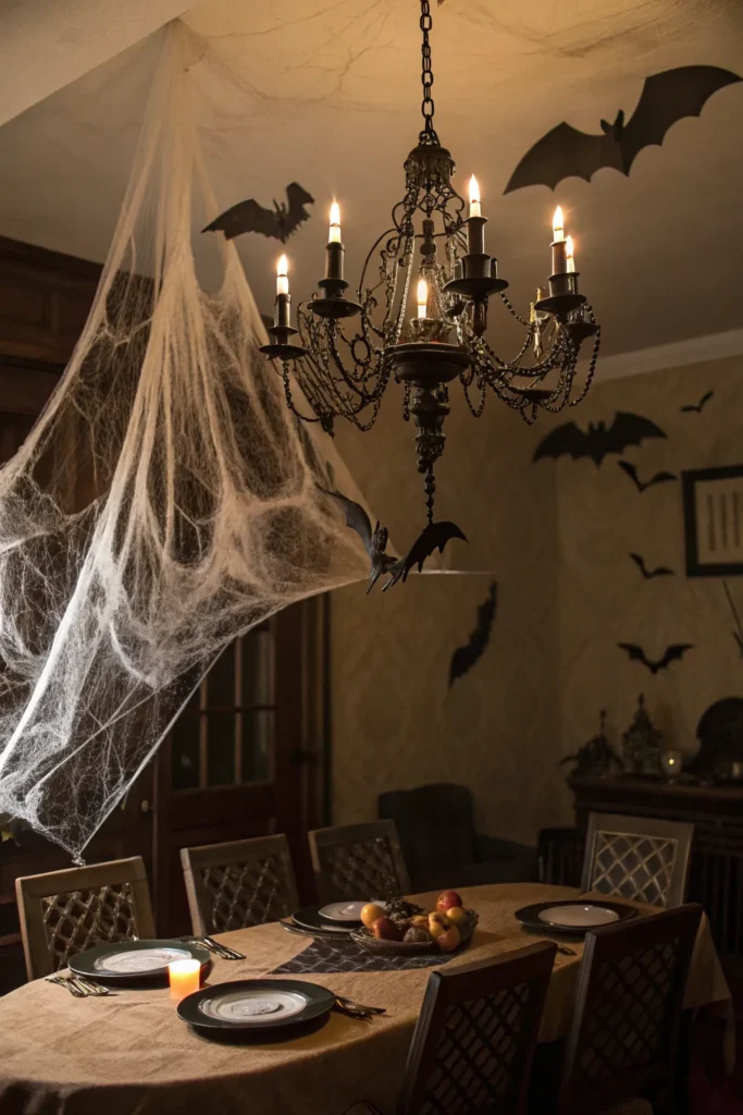 15 fake cobwebs draped from a chandelier above a