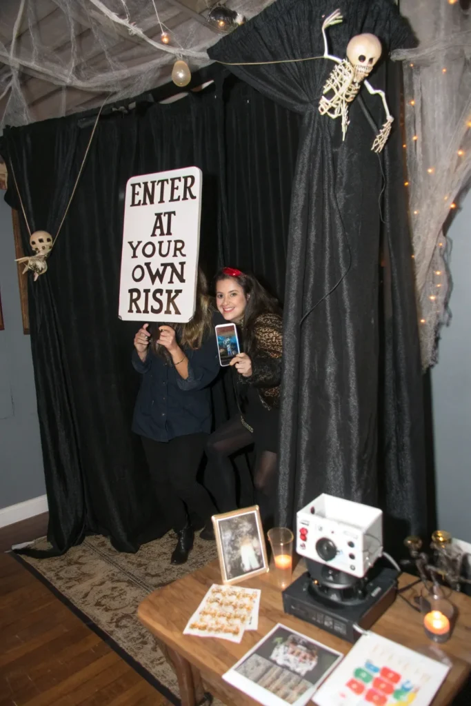 3 a photo booth with black curtains fake cobweb