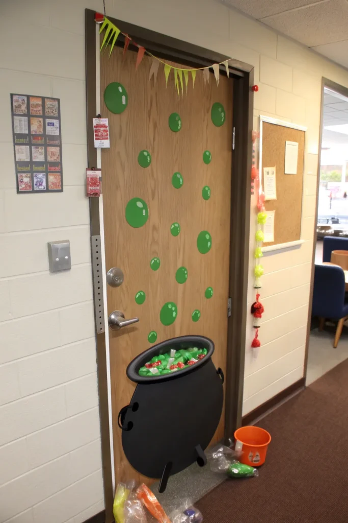 6 witch s cauldron a dorm door decorated with a