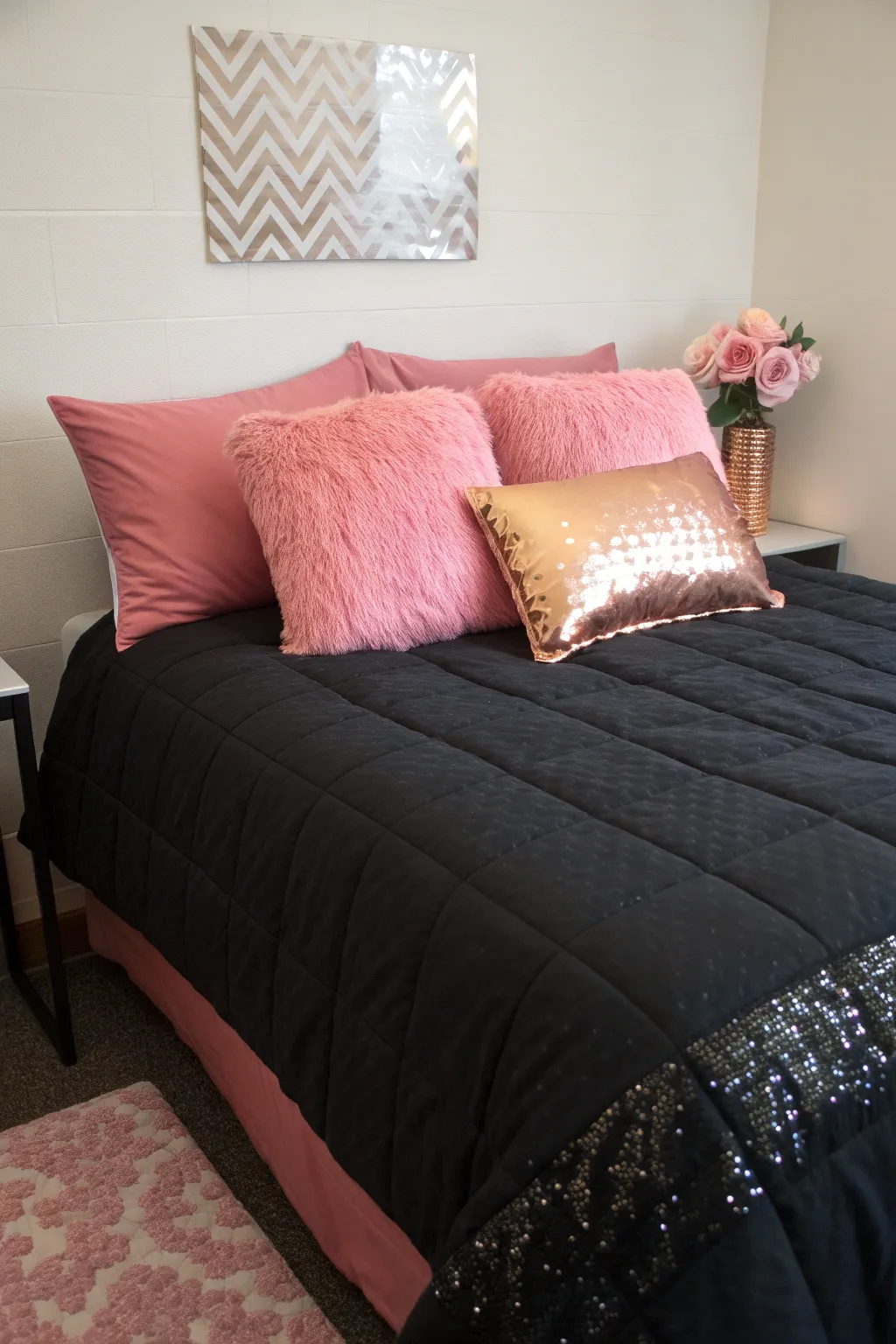 1 a neatly made dorm bed with a sleek black comf
